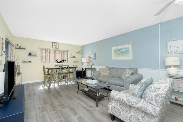 22375 Edgewater Dr Unit 123, Punta Gorda, FL 33980 - living room featuring baseboards, a ceiling fan, and wood finished floors