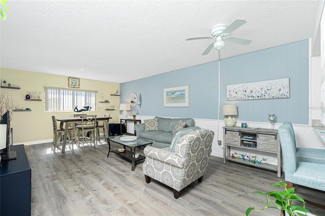 22375 Edgewater Dr Unit 123, Punta Gorda, FL 33980 - living area with ceiling fan, a textured ceiling, and wood finished floors