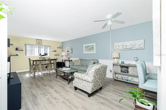 22375 Edgewater Dr Unit 123, Punta Gorda, FL 33980 - living room featuring a ceiling fan, a textured ceiling, and wood finished floors