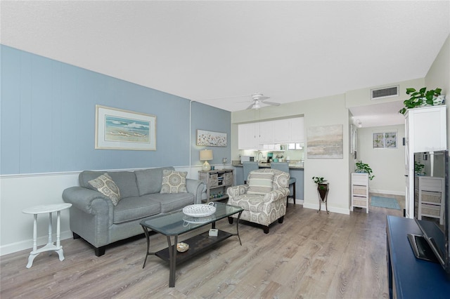 22375 Edgewater Dr Unit 123, Punta Gorda, FL 33980 - living area featuring ceiling fan, light wood-style floors, and visible vents