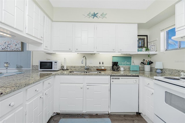 22375 Edgewater Dr Unit 123, Punta Gorda, FL 33980 - kitchen with light stone countertops, white appliances, a sink, white cabinetry, and dark wood-type flooring