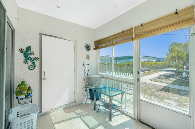 22375 Edgewater Dr Unit 123, Punta Gorda, FL 33980 - sunroom / solarium with tile patterned flooring and a textured wall