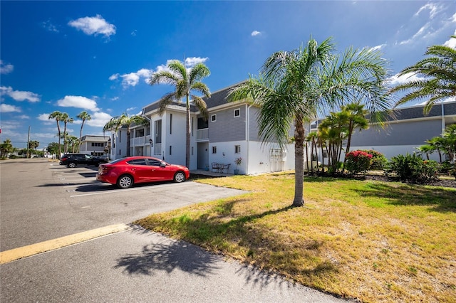 22375 Edgewater Dr Unit 123, Punta Gorda, FL 33980 - view of front of home featuring uncovered parking and a front yard