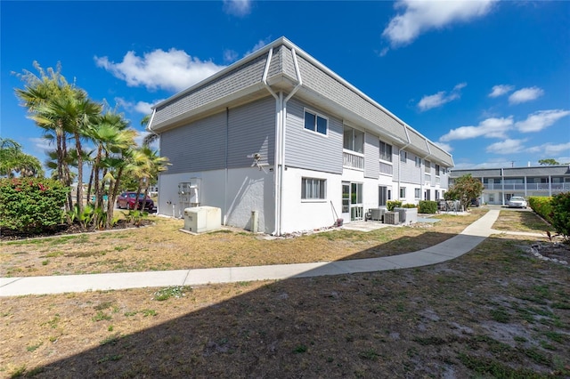 22375 Edgewater Dr Unit 123, Punta Gorda, FL 33980 - rear view of property with central AC unit