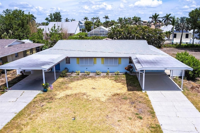 320 W Ann St, Punta Gorda, FL 33950 - ranch-style home with driveway and an attached carport