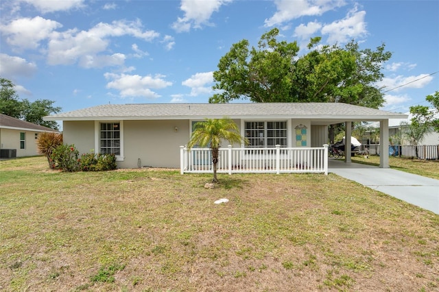 2331 Cannolot Blvd, Port Charlotte, FL 33948 - ranch-style house with concrete driveway, a front yard, an attached carport, a porch, and cooling unit
