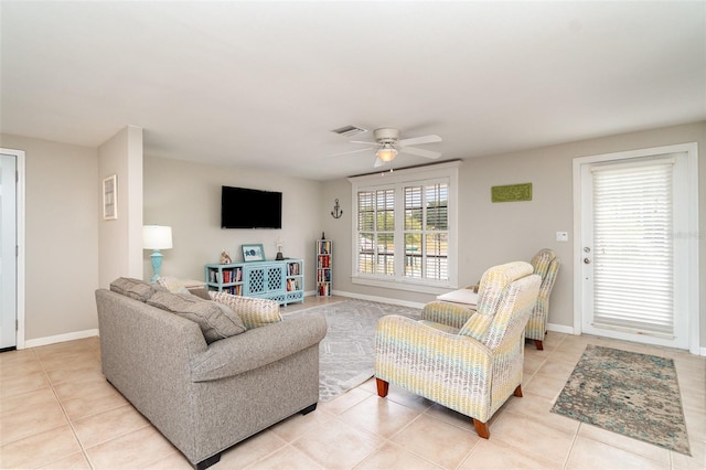 2331 Cannolot Blvd, Port Charlotte, FL 33948 - living room with ceiling fan, light tile patterned flooring, and baseboards