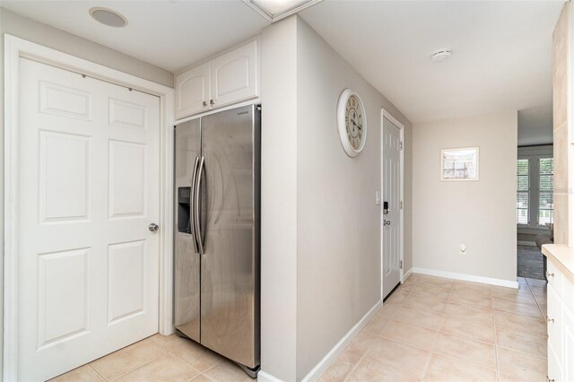 2331 Cannolot Blvd, Port Charlotte, FL 33948 - hall featuring light tile patterned floors and baseboards