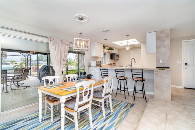 2331 Cannolot Blvd, Port Charlotte, FL 33948 - dining space with light tile patterned flooring and baseboards