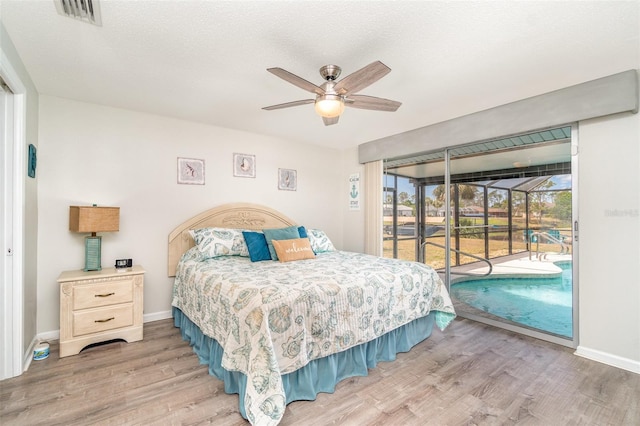 2331 Cannolot Blvd, Port Charlotte, FL 33948 - bedroom with access to outside, wood finished floors, baseboards, and a sunroom