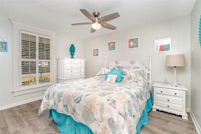 2331 Cannolot Blvd, Port Charlotte, FL 33948 - bedroom with wood finished floors, multiple windows, and baseboards