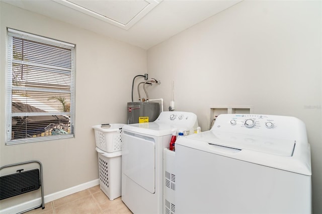 2331 Cannolot Blvd, Port Charlotte, FL 33948 - clothes washing area with heating unit, water heater, independent washer and dryer, light tile patterned floors, and baseboards