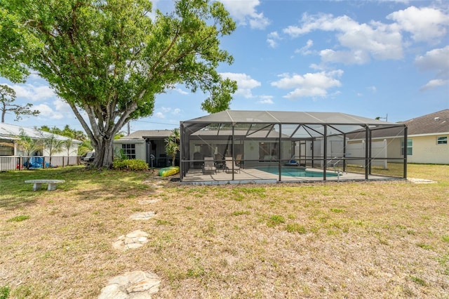 2331 Cannolot Blvd, Port Charlotte, FL 33948 - back of house featuring a patio area, a yard, and glass enclosure