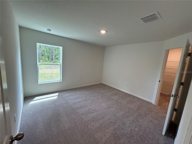 70 Karas Trl, Palm Coast, FL 32164 - spare room with carpet, baseboards, and visible vents