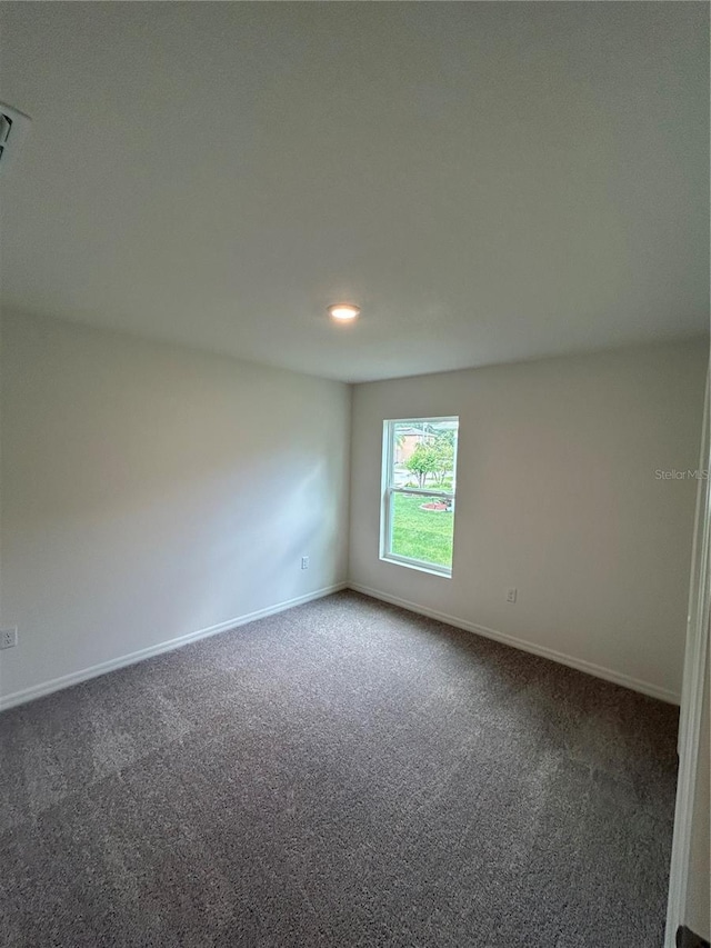 70 Karas Trl, Palm Coast, FL 32164 - carpeted empty room with baseboards