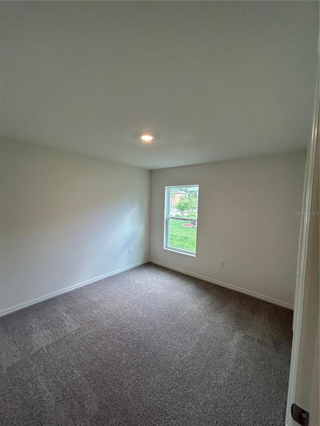 70 Karas Trl, Palm Coast, FL 32164 - carpeted spare room featuring baseboards
