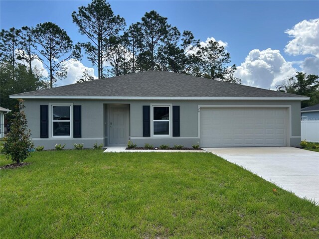 70 Karas Trl, Palm Coast, FL 32164 - ranch-style house featuring an attached garage, stucco siding, a shingled roof, a front lawn, and driveway