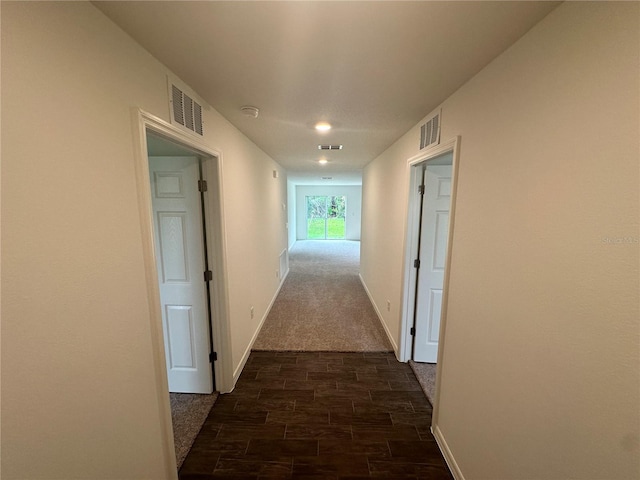 17 Luther Dr, Palm Coast, FL 32137 - hallway featuring dark wood finished floors and baseboards