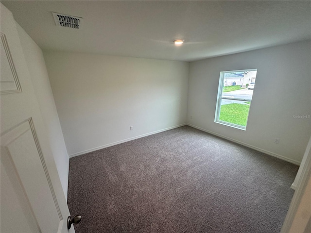 17 Luther Dr, Palm Coast, FL 32137 - carpeted empty room with baseboards