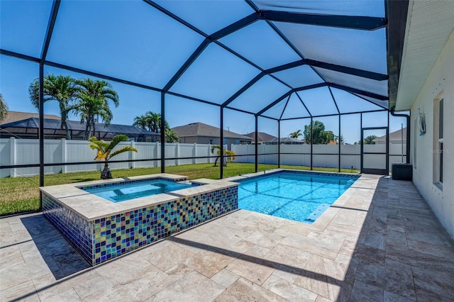 1443 SW 1st St, Cape Coral, FL 33991 - view of pool featuring an in-ground hot tub, a patio, a fenced backyard, and a lanai