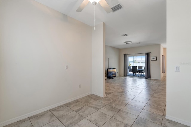 1443 SW 1st St, Cape Coral, FL 33991 - spare room featuring light tile patterned flooring, ceiling fan, and baseboards