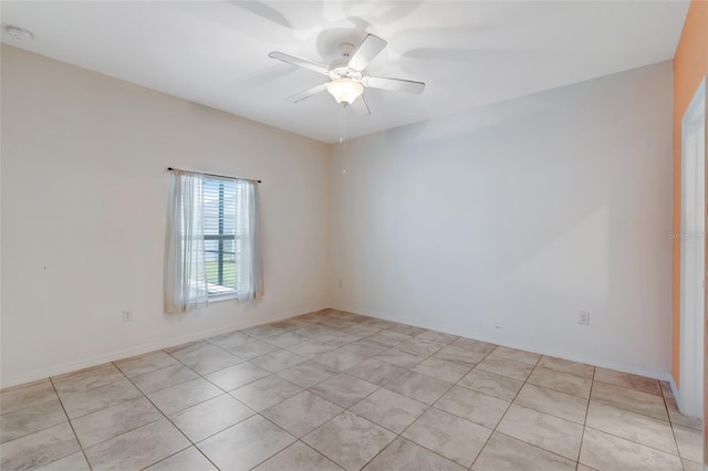 1443 SW 1st St, Cape Coral, FL 33991 - empty room featuring a ceiling fan, light tile patterned flooring, and a smoke detector