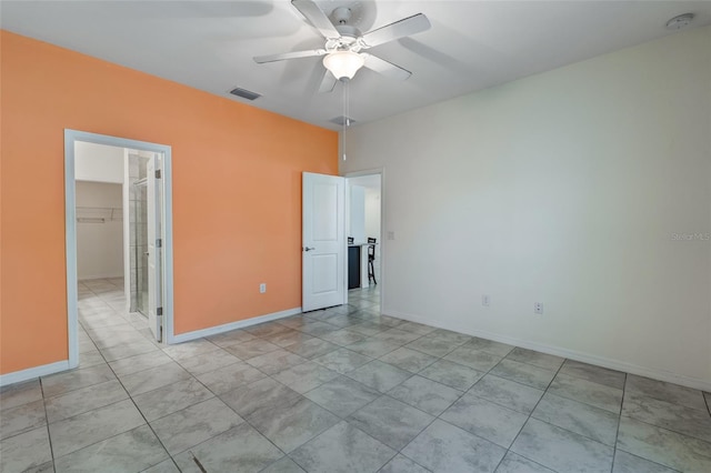 1443 SW 1st St, Cape Coral, FL 33991 - empty room with ceiling fan, a smoke detector, and baseboards