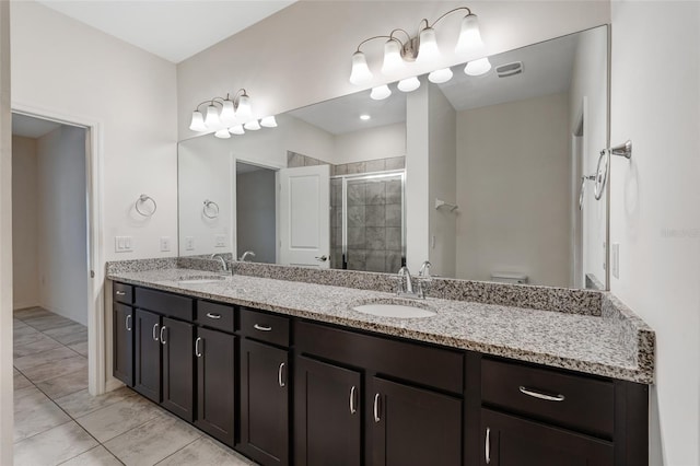 1443 SW 1st St, Cape Coral, FL 33991 - bathroom featuring a stall shower, double vanity, and toilet