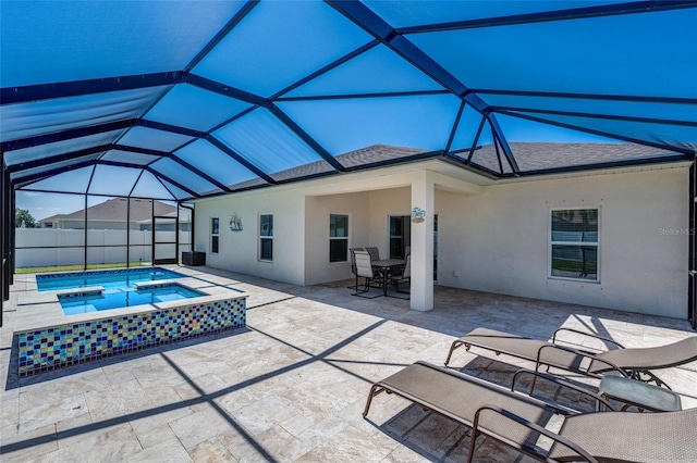 1443 SW 1st St, Cape Coral, FL 33991 - back of property with an in-ground hot tub, a patio area, stucco siding, and roof with shingles