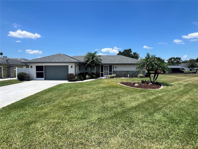 ranch-style home featuring stucco siding, an attached garage, a front lawn, and driveway
