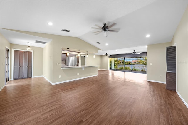 376 Portofino Dr, Punta Gorda, FL 33950 - unfurnished living room with a ceiling fan, lofted ceiling, wood finished floors, baseboards, and recessed lighting