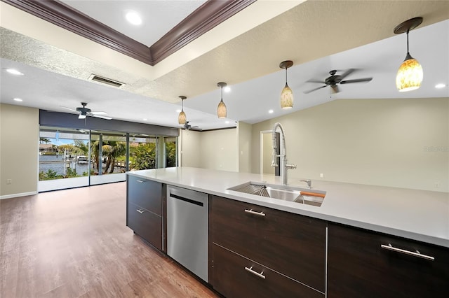 376 Portofino Dr, Punta Gorda, FL 33950 - kitchen featuring a sink, stainless steel dishwasher, ceiling fan, light countertops, and light wood-type flooring