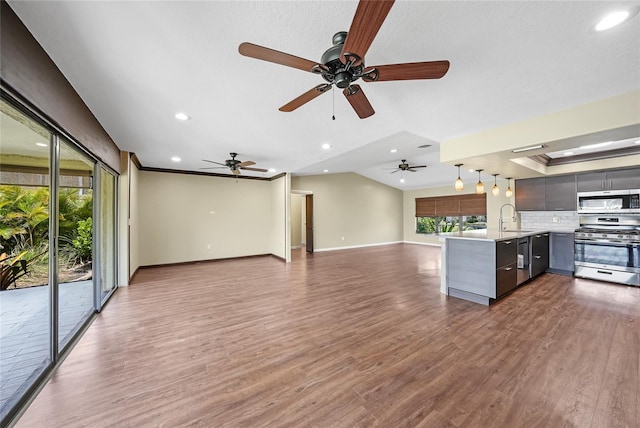 376 Portofino Dr, Punta Gorda, FL 33950 - unfurnished living room with a sink, baseboards, recessed lighting, a ceiling fan, and dark wood-style flooring