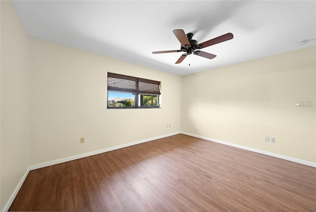376 Portofino Dr, Punta Gorda, FL 33950 - spare room with wood finished floors, baseboards, ceiling fan, and a smoke detector
