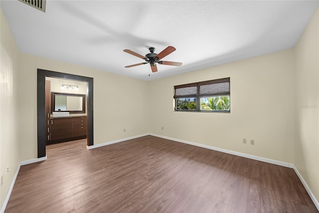 376 Portofino Dr, Punta Gorda, FL 33950 - spare room with baseboards, ceiling fan, and wood finished floors