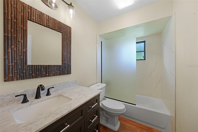 376 Portofino Dr, Punta Gorda, FL 33950 - bathroom with wood finished floors, toilet, vanity, and bathtub / shower combination