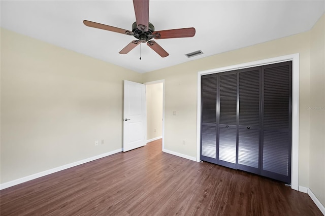 376 Portofino Dr, Punta Gorda, FL 33950 - unfurnished bedroom with wood finished floors, baseboards, a closet, and a ceiling fan