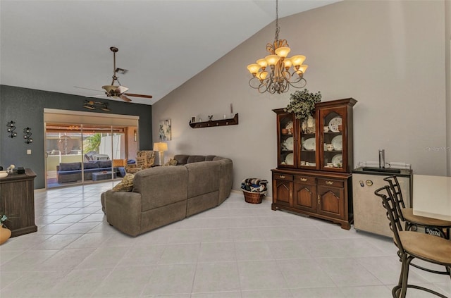living area featuring light tile patterned floors, lofted ceiling, and ceiling fan with notable chandelier