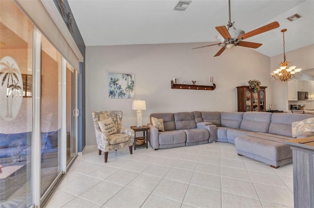 living area with visible vents, lofted ceiling, light tile patterned flooring, and ceiling fan with notable chandelier