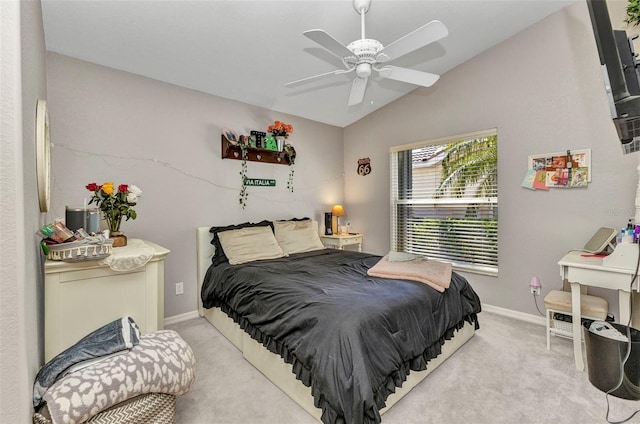 bedroom with lofted ceiling, light carpet, baseboards, and a ceiling fan