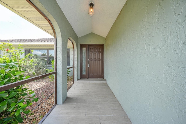 view of exterior entry featuring stucco siding