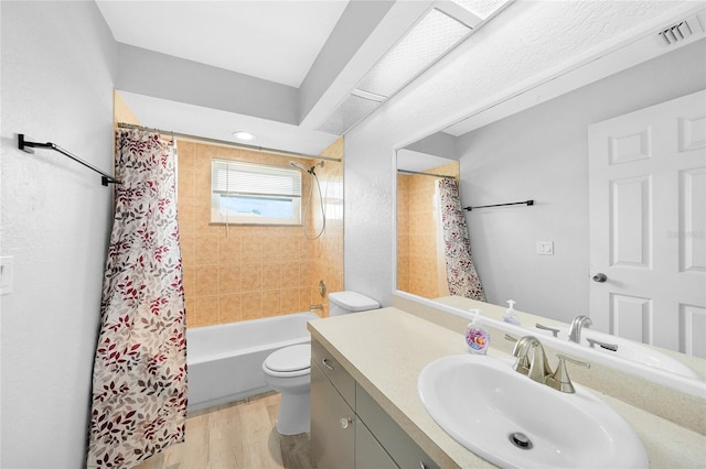 full bathroom with toilet, vanity, wood finished floors, and shower / bath combination with curtain