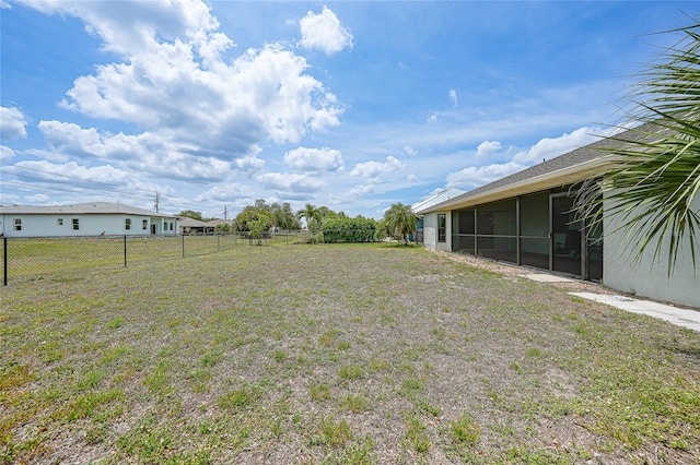 view of yard with a sunroom