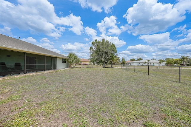 view of yard with a sunroom