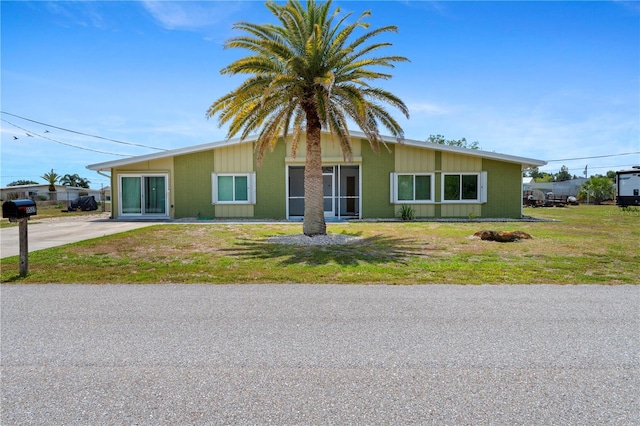 view of front of home with a front yard