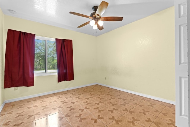5527 Fairway Dr S, Punta Gorda, FL 33982 - empty room with ceiling fan, a smoke detector, and baseboards