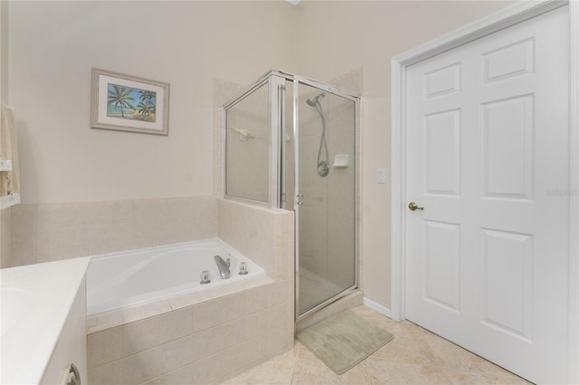 3412 Grand Vista Ct Unit 202, Port Charlotte, FL 33953 - full bath with a shower stall, tile patterned floors, a garden tub, and vanity