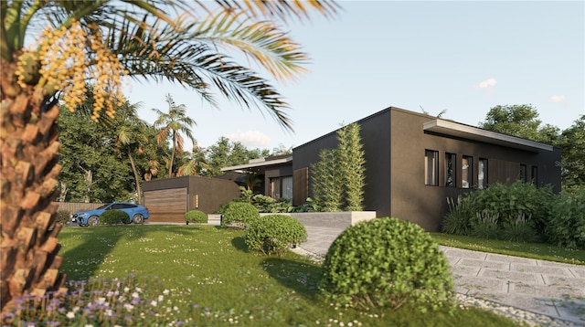 view of home's exterior with stucco siding and a yard