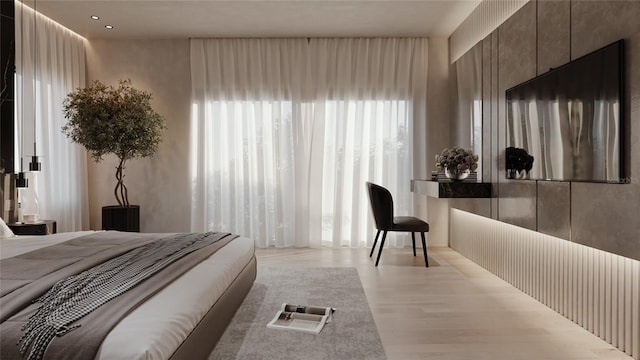 bedroom featuring light wood-style floors
