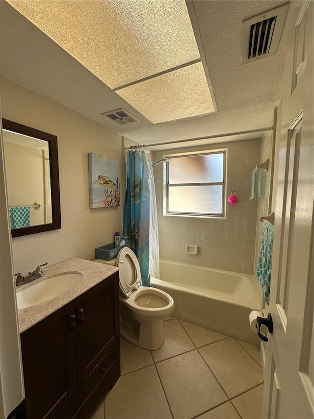 full bath featuring toilet, shower / tub combo with curtain, visible vents, tile patterned floors, and vanity